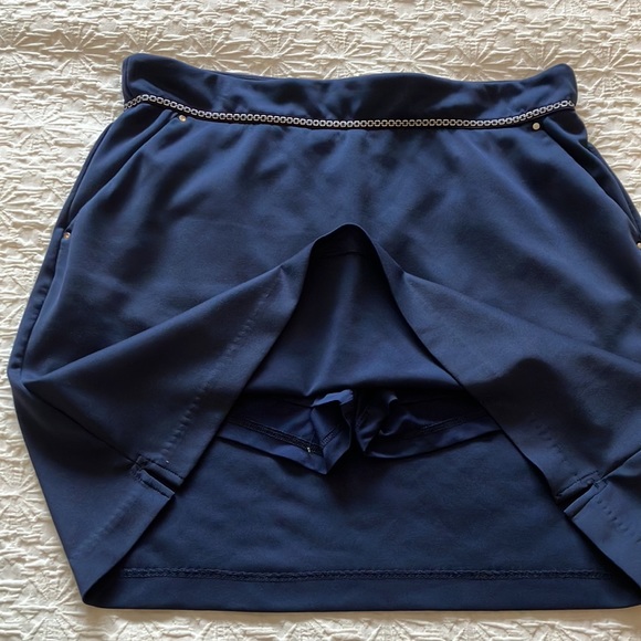 Great Greg Norman navy skort with navy and silver braid around waistband. - Picture 3 of 15